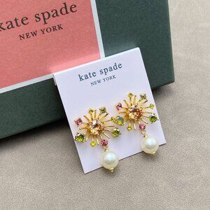 Kate Spade Pearl earrings paired with pink diamond studs